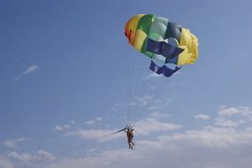 paragliding, two persons on wing in sky