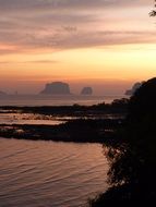 pastel colored sunset sky above sea coast, thailand, krabi