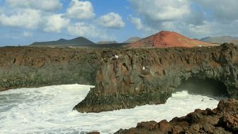 coast of lanzarote with white waves