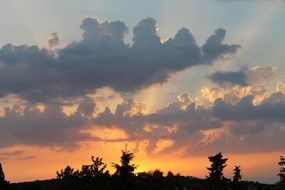 orange fluffy clouds in the evening sky