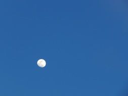 white moon on blue clear sky