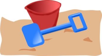 painted red bucket and blue spade in the sand