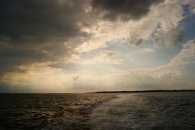 grey clouds above water at evening