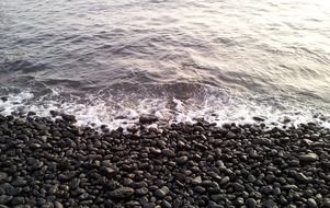 beach with black pebbles on Hawaii