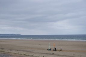 remote view of sailboats in the sand on the beach