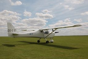 plane on the green field