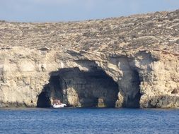 distant view of the caves on the Mediterranean coast