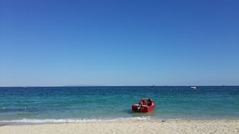 red boat on the island of Kish