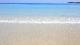 white sand on the ocean beach in jeju