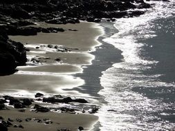 shiny water on the beach on a sunny day