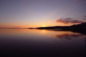 sunset over the hills near the sea