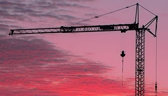 crane against pink sky