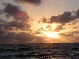 sunlight at sunset over the ocean