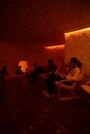 People rest color therapy salt cave