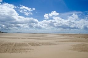 tourist beach under white clouds