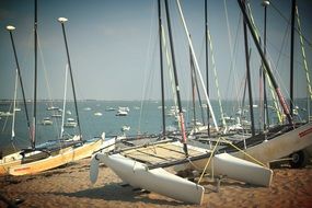 white catamaran on the coast of france