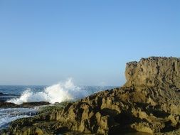 dark rock at blue sea