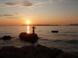 girl silhouette on sunset background in croatia
