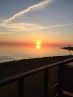evening sky with the sun over the sea