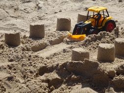 Tractor toy on sand beach