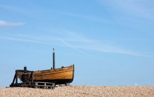 wooden fishing boat on beach