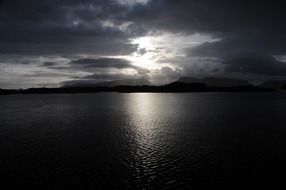 black and white photo of sunset in norway