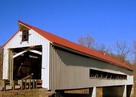 covered wooden bridge in countryside