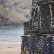 pile of fishing baskets at sea