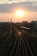 train tracks going into the sunset
