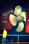 huge propeller of the ship and persons