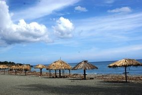 beach wooden umbrellas on the sand