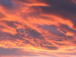 Beautiful evening sky with the clouds in the red glow of sunset