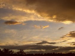 clouds with a yellow glow in the sky