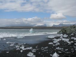 black sand beach and iceberg iceland