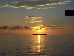 beautiful sunset over an island in the ocean