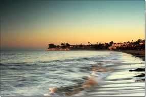 waves on the beach during sunset