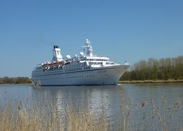 Cruise ship in the background of picturesque shores