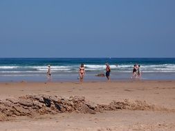 people on the beach in Cantabria