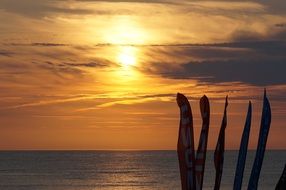 flags on near north sea in sunset