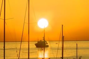 golden sunrise above calm sea, italy, sicily, san vito lo capo