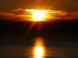 sunny path on the lake during sunset