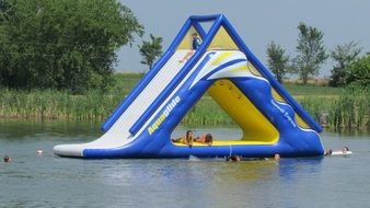 Inflatable water slides on the lake