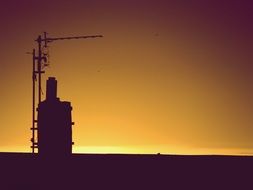 silhouette of the chimney at sunset