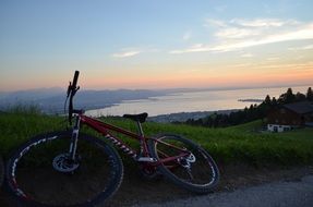 bike lies on the green grass