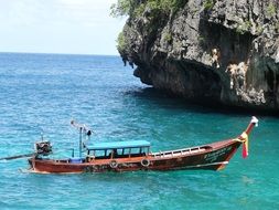 fishing boat in the turquoise ocean