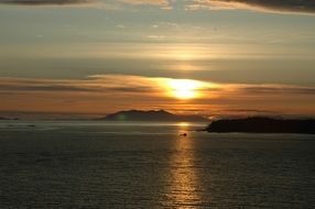 fishing boat on sunset ocean, usa, alaska