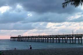 fisher near the pier