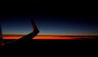 detail of aircraft at sunset sky