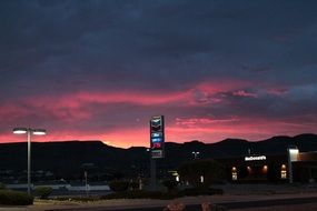 pink sunset over a gas station in california