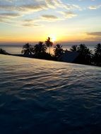 sunset over the pool in Thailand